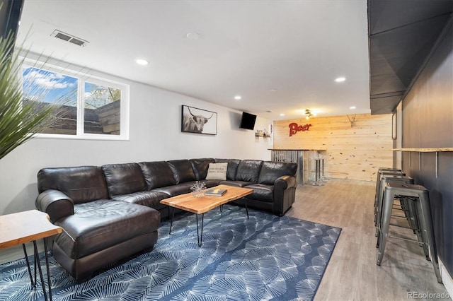 882 E Briarwood Cir, Centennial, CO 80122 - living room featuring visible vents, wood walls, wood finished floors, and recessed lighting