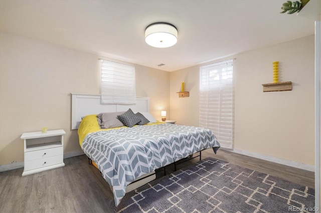 882 E Briarwood Cir, Centennial, CO 80122 - bedroom featuring baseboards and wood finished floors
