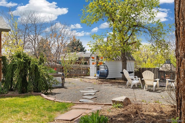 882 E Briarwood Cir, Centennial, CO 80122 - view of yard featuring a storage shed, an outdoor structure, and a fenced backyard