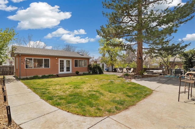 882 E Briarwood Cir, Centennial, CO 80122 - view of yard with french doors, fence, and a patio area