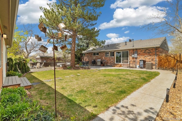 882 E Briarwood Cir, Centennial, CO 80122 - view of yard featuring a patio, central air condition unit, fence, and entry steps
