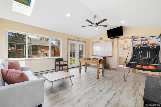 882 E Briarwood Cir, Centennial, CO 80122 - recreation room with ceiling fan, baseboard heating, french doors, wood finished floors, and lofted ceiling with skylight