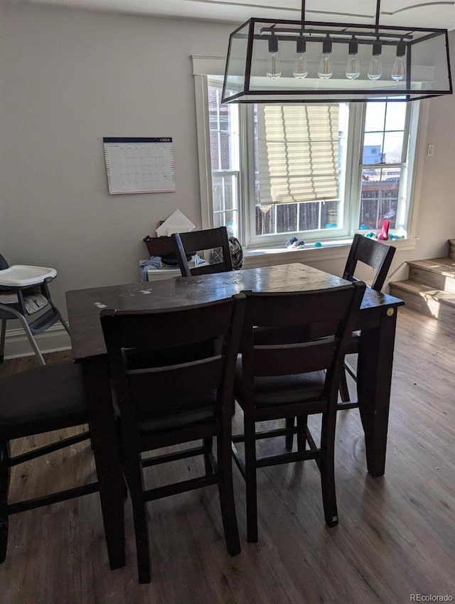 dining area featuring wood-type flooring