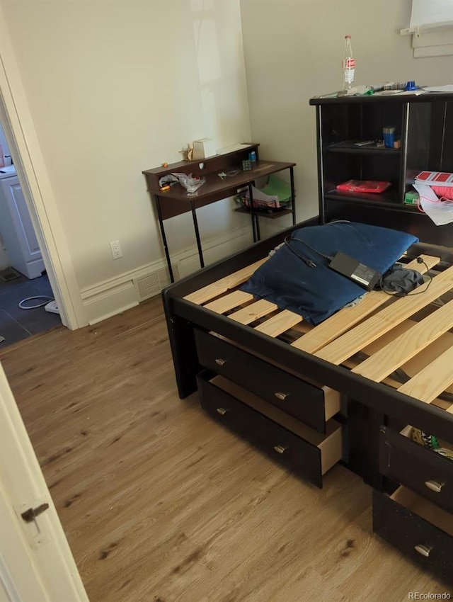 bedroom featuring hardwood / wood-style flooring