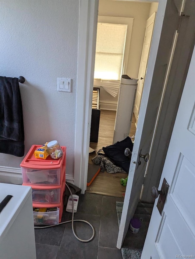 bathroom with tile patterned floors