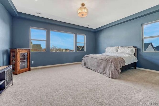 carpeted bedroom with baseboards