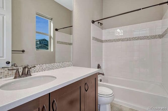 full bathroom featuring vanity,  shower combination, and toilet