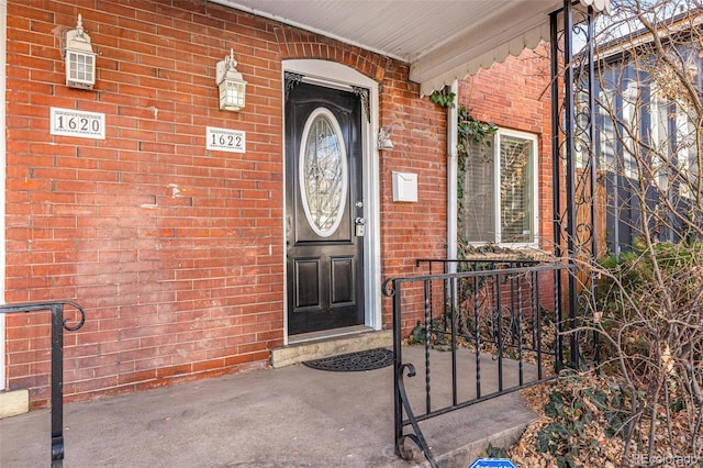 property entrance with covered porch