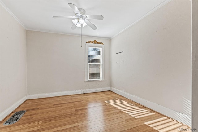 unfurnished room featuring ceiling fan, ornamental molding, and light hardwood / wood-style flooring