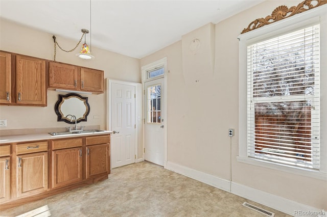 kitchen with sink and decorative light fixtures