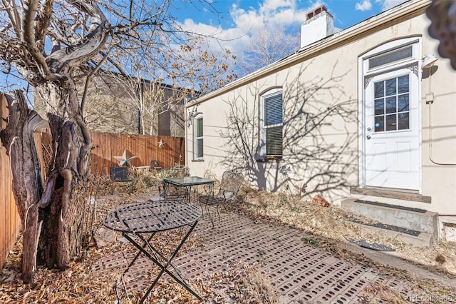 view of property exterior with a patio