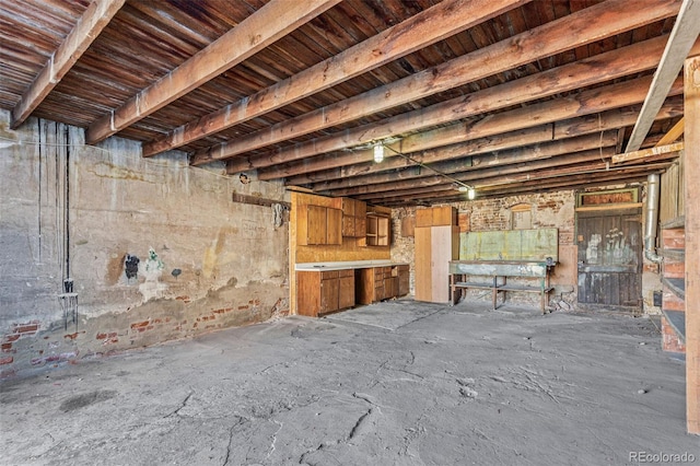 miscellaneous room with beamed ceiling