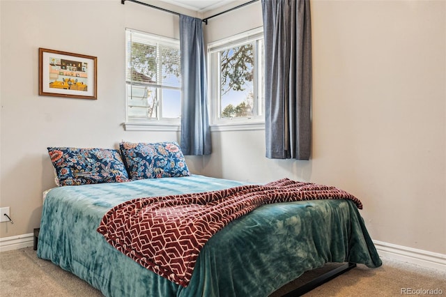 carpeted bedroom with baseboards