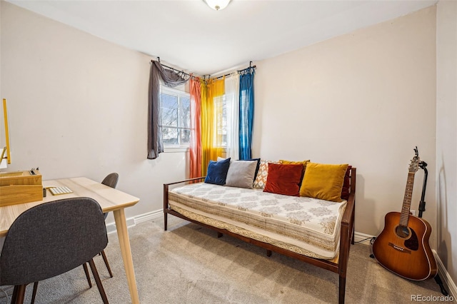 bedroom featuring baseboards and carpet