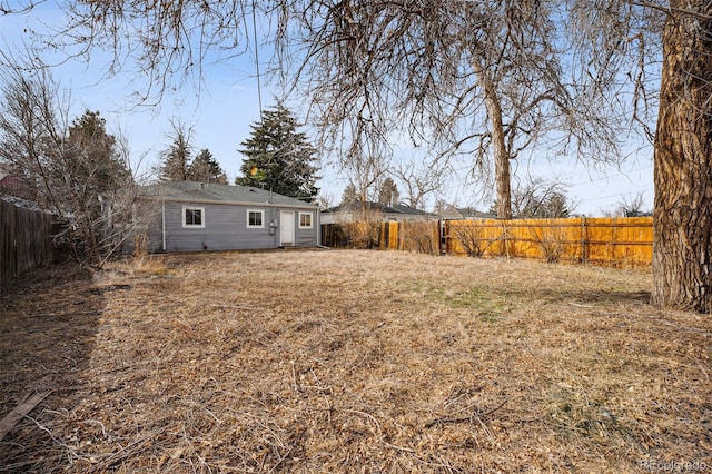 view of yard with a fenced backyard