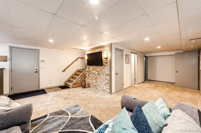 carpeted living area with recessed lighting, stairs, a drop ceiling, and baseboards