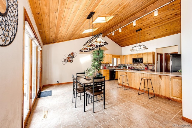 dining area with light tile patterned floors, baseboards, track lighting, wood ceiling, and lofted ceiling
