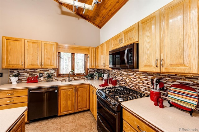 kitchen with light tile patterned floors, a sink, light countertops, dishwashing machine, and double oven range