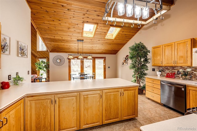 kitchen featuring tasteful backsplash, light countertops, a skylight, dishwasher, and wood ceiling