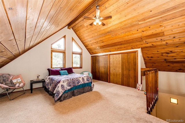 bedroom featuring a closet, lofted ceiling with beams, carpet flooring, ceiling fan, and wood ceiling