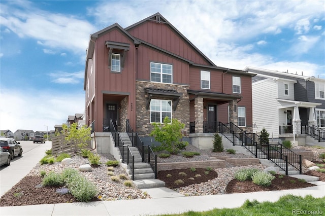 9804 Rosalee Peak St, Littleton, CO 80125 - view of front of property featuring board and batten siding, stone siding, and stairs