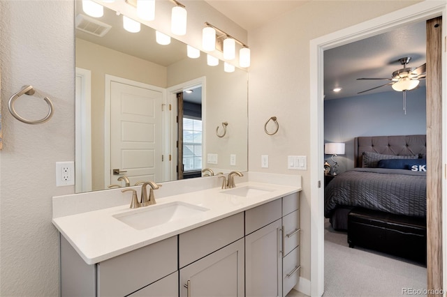 9804 Rosalee Peak St, Littleton, CO 80125 - ensuite bathroom featuring a ceiling fan and double vanity