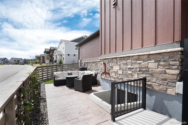 9804 Rosalee Peak St, Littleton, CO 80125 - wooden terrace with an outdoor hangout area and a residential view