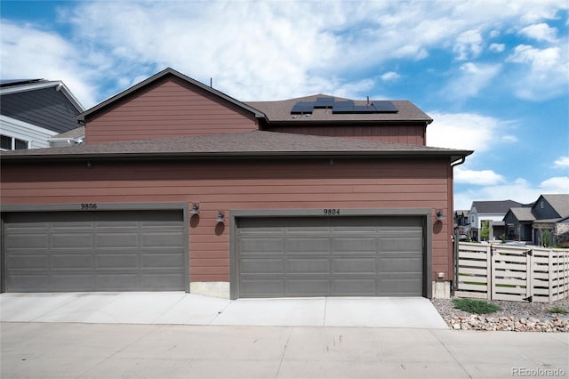 9804 Rosalee Peak St, Littleton, CO 80125 - garage with solar panels and concrete driveway