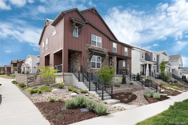 9804 Rosalee Peak St, Littleton, CO 80125 - view of front of property featuring a residential view, board and batten siding, and stone siding