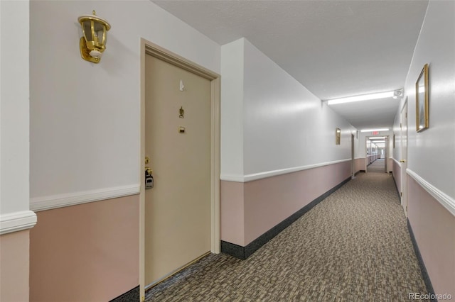 13606 E Bates Ave Unit 304, Aurora, CO 80014 - corridor featuring carpet flooring and baseboards