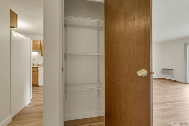 13606 E Bates Ave Unit 304, Aurora, CO 80014 - closet with a wall mounted AC and a sink
