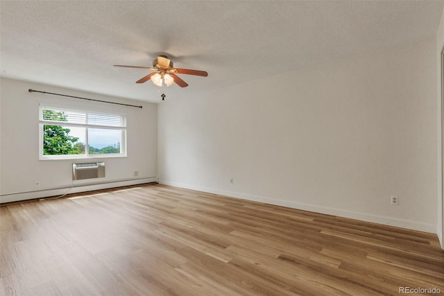13606 E Bates Ave Unit 304, Aurora, CO 80014 - empty room featuring baseboard heating, light wood-type flooring, ceiling fan, baseboards, and a textured ceiling