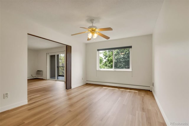 13606 E Bates Ave Unit 304, Aurora, CO 80014 - empty room featuring a baseboard radiator, light wood-style flooring, ceiling fan, and baseboards