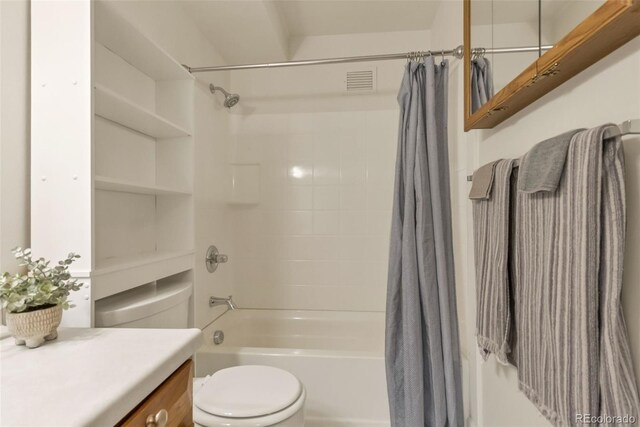 13606 E Bates Ave Unit 304, Aurora, CO 80014 - bathroom with toilet, shower / tub combo with curtain, and vanity