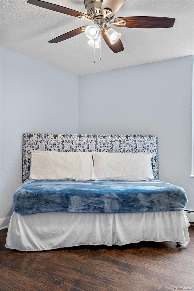 2281 Vaughn Unit 104A, Aurora, CO 80014 - bedroom featuring wood finished floors, ceiling fan, and baseboards