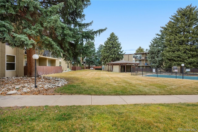 2281 Vaughn Unit 104A, Aurora, CO 80014 - view of yard featuring a community pool