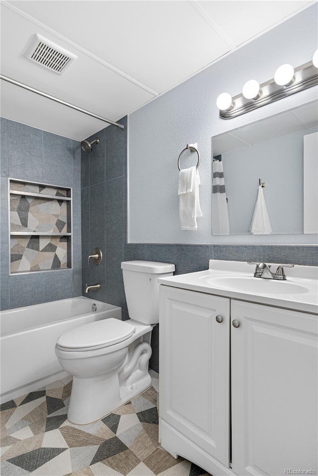 2281 Vaughn Unit 104A, Aurora, CO 80014 - full bath with vanity, washtub / shower combination, and tile walls