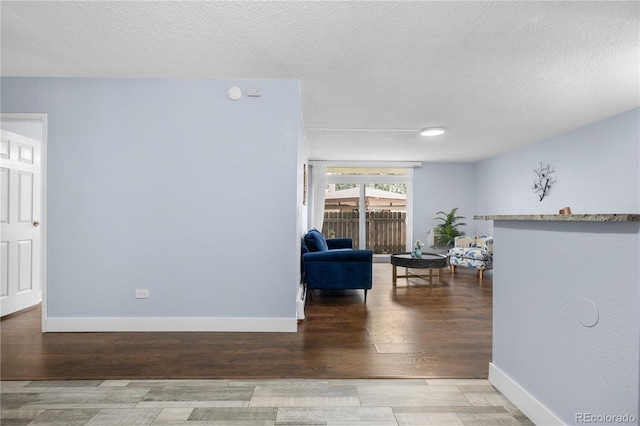 2281 Vaughn Unit 104A, Aurora, CO 80014 - living room with wood finished floors and a textured ceiling