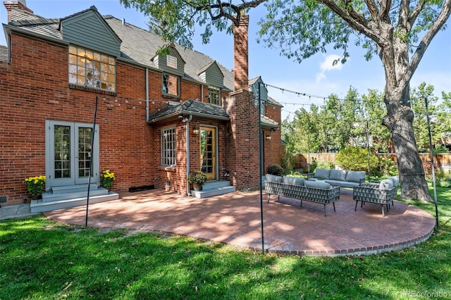 exterior space featuring an outdoor hangout area, a patio, and a lawn