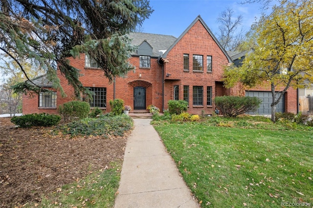 tudor home with a front yard