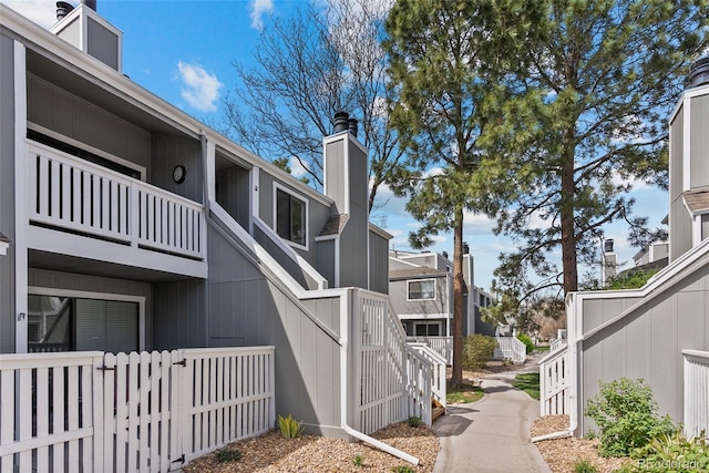 view of property's community with fence