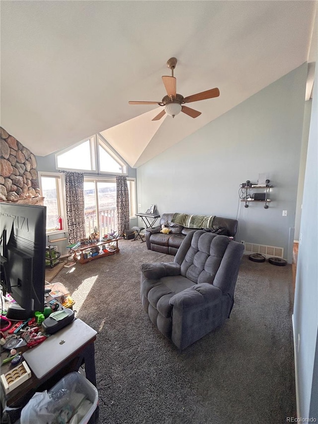 carpeted living room featuring ceiling fan and vaulted ceiling