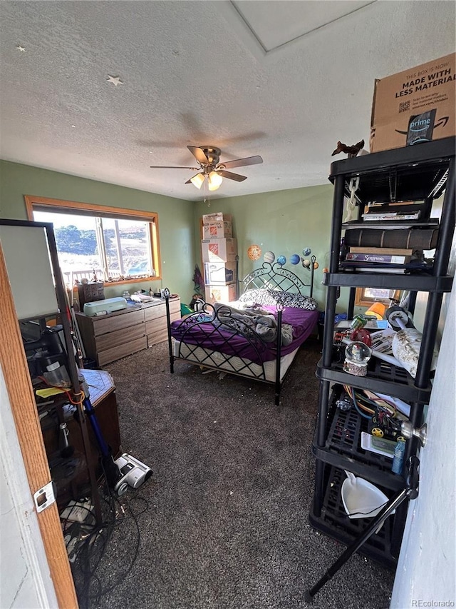 bedroom with a textured ceiling and ceiling fan