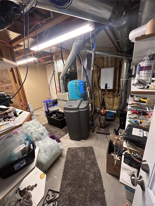 basement featuring tankless water heater