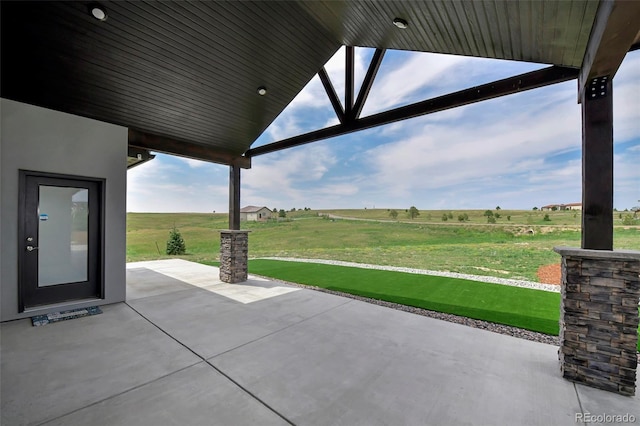 view of patio / terrace with a rural view