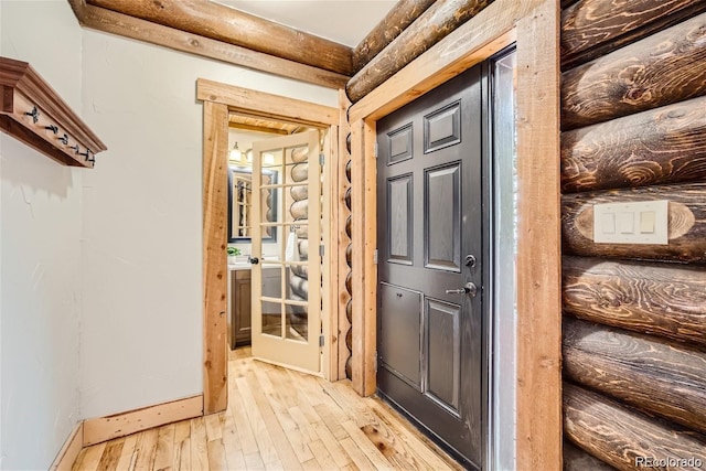 entryway with light hardwood / wood-style floors