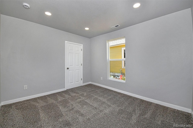228 E Las Vegas St, Colorado Springs, CO 80903 - empty room with dark carpet, baseboards, a smoke detector, and recessed lighting