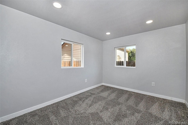 228 E Las Vegas St, Colorado Springs, CO 80903 - unfurnished room featuring dark carpet, recessed lighting, and baseboards
