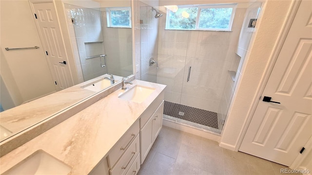 10538 Tiger Chase, Lone Tree, CO 80124 - full bathroom featuring plenty of natural light, double vanity, a shower stall, and tile patterned floors