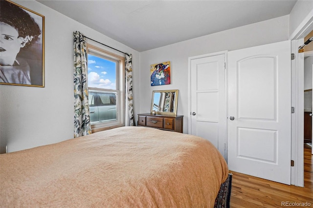 bedroom with wood finished floors